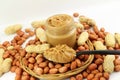 Peanut butter and peanuts whole and peeled in white background Royalty Free Stock Photo