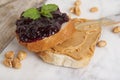 Peanut butter and raspberry jelly sandwich on white background. Sweet breakfast or snack. Close up. Royalty Free Stock Photo