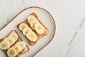 Peanut butter sandwich with fresh banana slices Royalty Free Stock Photo