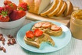 Peanut butter and strawberry sandwiches. Breakfast the view from the top. Plate of sandwiches with peanut butter, jam Royalty Free Stock Photo