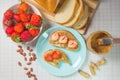 Peanut butter and strawberry sandwiches. Breakfast the view from the top. Plate of sandwiches with peanut butter, jam Royalty Free Stock Photo