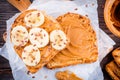 Peanut butter toast with banana slices and flax seeds Royalty Free Stock Photo