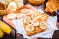 Peanut butter toast with banana slices and flax seeds Royalty Free Stock Photo