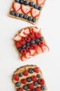 Peanut butter toasts with fresh seasonal berries Royalty Free Stock Photo