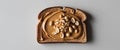 Peanut butter on whole wheat toast with peanuts. Royalty Free Stock Photo