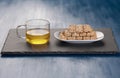 Peanut candy with tea on the black board Royalty Free Stock Photo