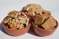 Peanut chikki, Crushed roaste peanut chiki, Rajgiri chikki or Amaranth brittle bars. Jaggery with peanut candy bars served in Royalty Free Stock Photo