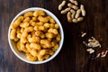 Peanut Chips on dark wooden surface. Royalty Free Stock Photo