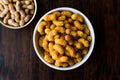 Peanut Chips on dark wooden surface. Royalty Free Stock Photo