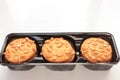 Peanut cookies in a box. Biscuits pack on white background. Royalty Free Stock Photo