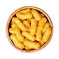Peanut flips, puffed peanut-flavored corn snack, in a wooden bowl