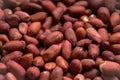 Peanut fruit with red peel close-up background