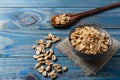 Peanut inside ceramic pot over blue pine wood Royalty Free Stock Photo