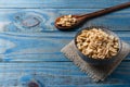 Peanut inside ceramic pot over blue pine wood Royalty Free Stock Photo