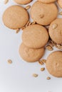 Peanut macarons flat lay on white background, minimal dessert texture Royalty Free Stock Photo