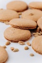 Peanut macarons flat lay on white background, minimal dessert texture Royalty Free Stock Photo