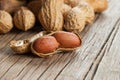 Peanut in nutshell on wooden background. Composition of peanuts Royalty Free Stock Photo