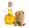 Peanut oil in a glass bottle with peanuts in bag Royalty Free Stock Photo