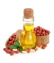 Peanut oil in a glass bottle with peanuts in bowl Royalty Free Stock Photo