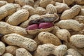 Peanut seeds on the background of peanut shells. Soft focus Royalty Free Stock Photo