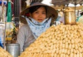 A peanut vendor at a market