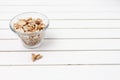 Peanuts in a bowl over a white rustic table Royalty Free Stock Photo