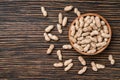 Peanuts on a brown wooden table,top view