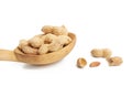 Peanuts lies in a wooden spoon, tasty fruit is isolated on a white background