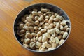 Peanuts in a metal bowl Royalty Free Stock Photo