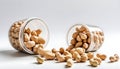 Peanuts that are opened and whose contents are coming out isolated on a white Royalty Free Stock Photo