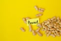 Peanuts pattern isolated on a yellow backround. Repetition concept Royalty Free Stock Photo
