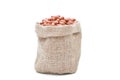 Peanuts raw grains in sack of on white background Royalty Free Stock Photo