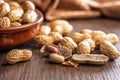 Peanuts in shell. Groundnuts on wooden table Royalty Free Stock Photo