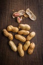 Peanuts in shell. Groundnuts on wooden table. Top view Royalty Free Stock Photo