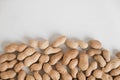 Peanuts in shell on a white background. Top view. Copy, empty space for text Royalty Free Stock Photo