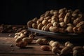 Peanuts in shells with fresh groundnut on a table.