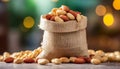 Peanuts in small burlap bag. Tasty and healthy snack. Natural backdrop