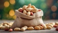 Peanuts in small burlap bag. Tasty and healthy snack. Natural backdrop