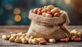 Peanuts in small burlap bag. Tasty and healthy snack. Natural backdrop