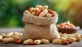 Peanuts in small burlap bag. Tasty and healthy snack. Natural backdrop