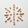 And peanuts in their shells are arranged on a white surface in a Royalty Free Stock Photo