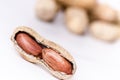 Peanuts on a white background. . Building from nuts. Balance. Open shell. Nutrition. Peanuts butter Royalty Free Stock Photo