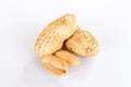 Peanuts are on a white background. There was a peanut seed that had been carved out in front Royalty Free Stock Photo