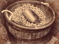 Peanuts wooden barrel full of nuts and a scoop retro vintage background