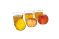 Pear, apple and peach in the background glasses with juice. Royalty Free Stock Photo