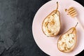 Healthy vegan dessert, baked pears with nuts and honey.Selective focus