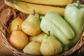 Pear, banana and green pepper in a basket