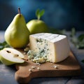 Pear and blue cheese plate, wine appetizer. Fresh sliced pear served with blue cheese on a wooden cutting board on wooden table