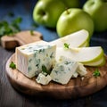 Pear and blue cheese plate, wine appetizer. Gourmet dish concept. Fresh pear slices served with blue cheese on a wooden cutting