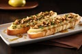 pear bruschetta duo on elongated rectangular dish